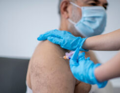 older man getting his COVID-19 vaccine