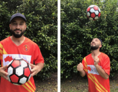 A young man holding a soccer ball.