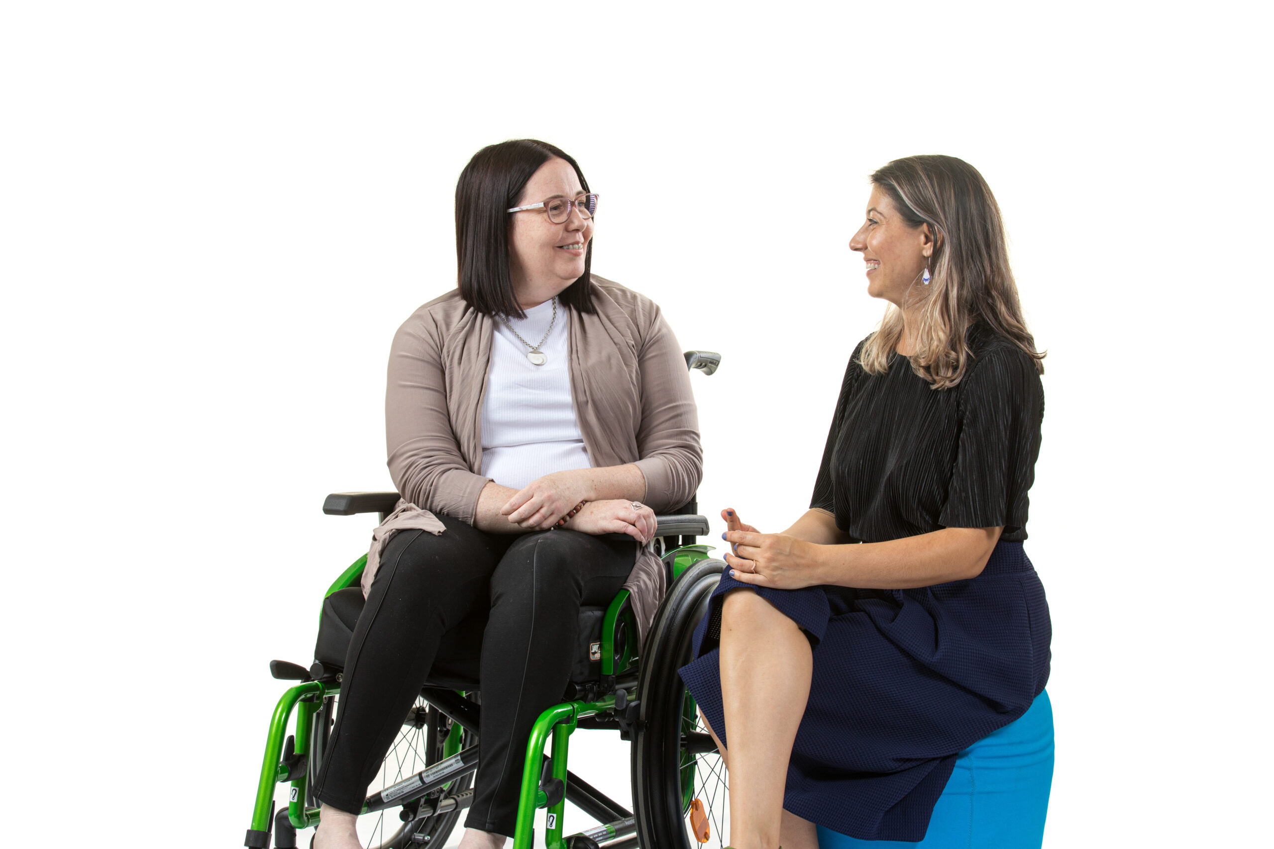 An IgniteAbility client sitting with her Ignite facilitator, who is providing one-on-one facilitation.