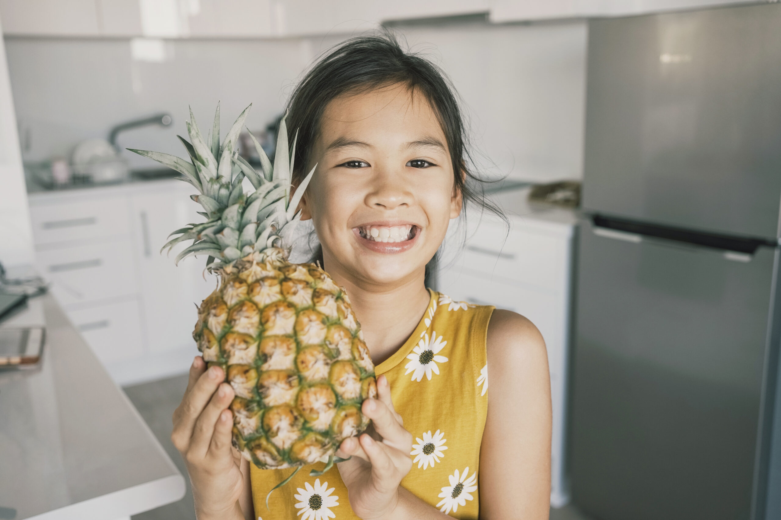 Smiling young girl of SSI's Multicultural Child and Family Program for foster care