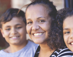 an Indigenous woman and her two children