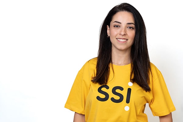 Salwa wearing a yellow SSI t-shirt