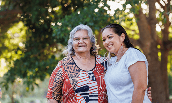 Two First Nations women smile