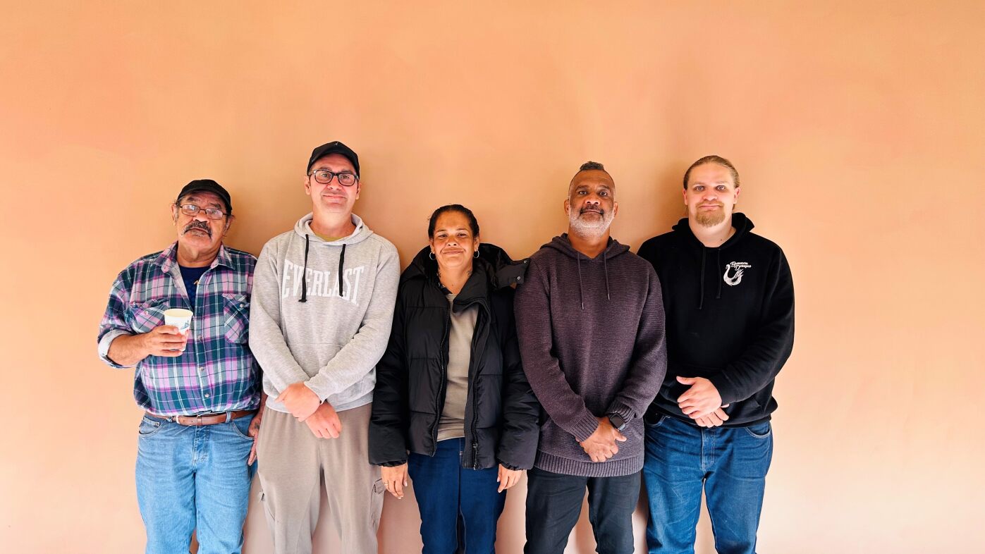 Artists in NAIDOC exhibition smile at camera