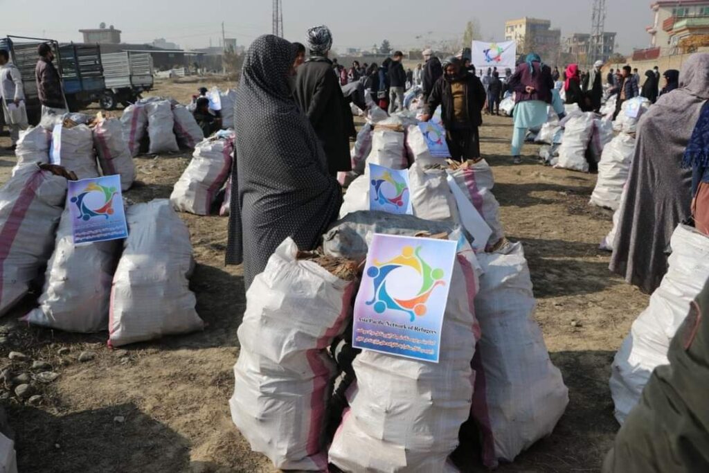 Afghan families collect emergency relief