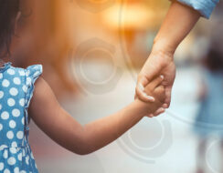 Man holding a little girl's hand