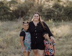 Heather Young, participant of SSI ParentsNext program, smiling alongside her two children.