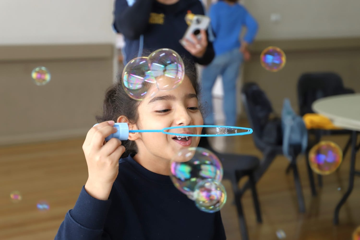 Girl blowing bubble