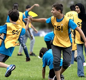 SSI community event in Sydney featuring children from the Humanitarian Settlement Program playing sport