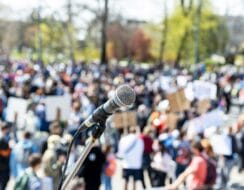 crowd of protesters with a mic