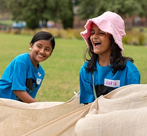Holiday camp for SSI Humanitarian Settlement Program featuring children playing games
