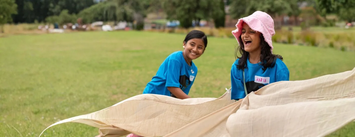 Holiday camp for SSI Humanitarian Settlement Program featuring children playing games
