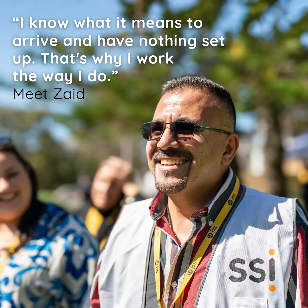 Zaid smiling in a crowd