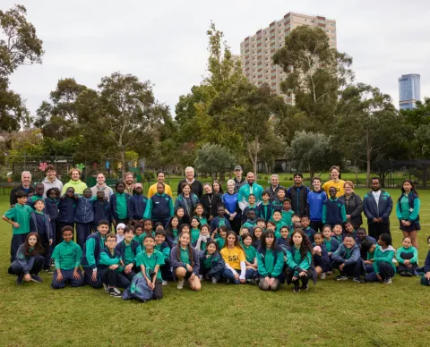 Group of students from Melbourne school captured together with former cricketer and SSI staff for Refugee Week