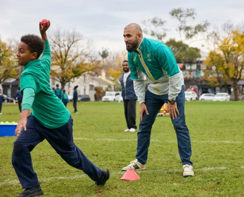 Cricketer Fawad Ahmed with school kids Refugee Week in Melbourne