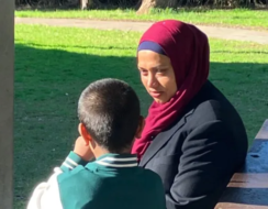 Mother sitting in the park with her son